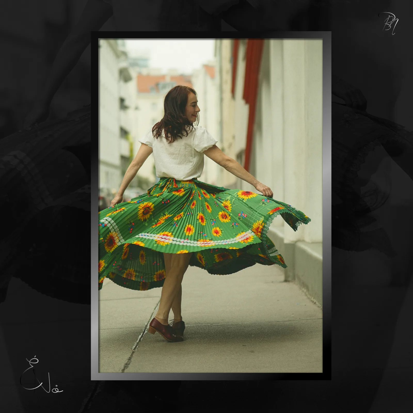 Sunflower skirt — Photo: Norbert Banhalmi A woman spins in a sunflower-printed skirt on a city street.