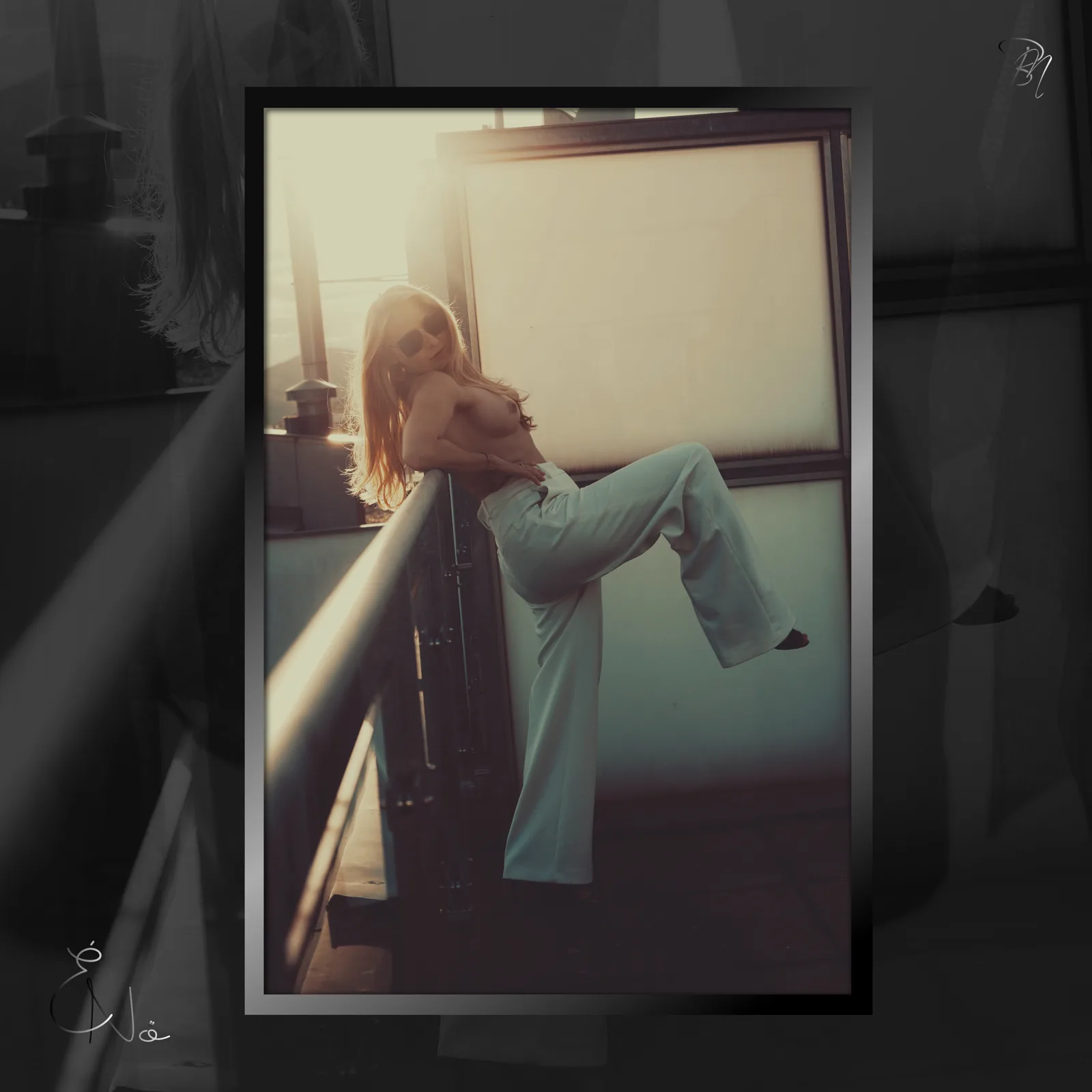 At the window — Photo: Norbert Banhalmi A woman sits on a windowsill in jeans, warm light coming in behind her.