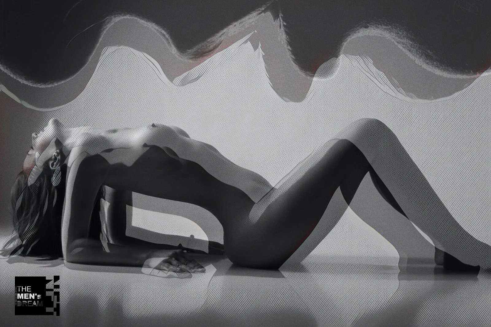 White wave — Photo: Norbert Banhalmi A reclining figure in high-key grey, a white wave of motion sweeping above her.
